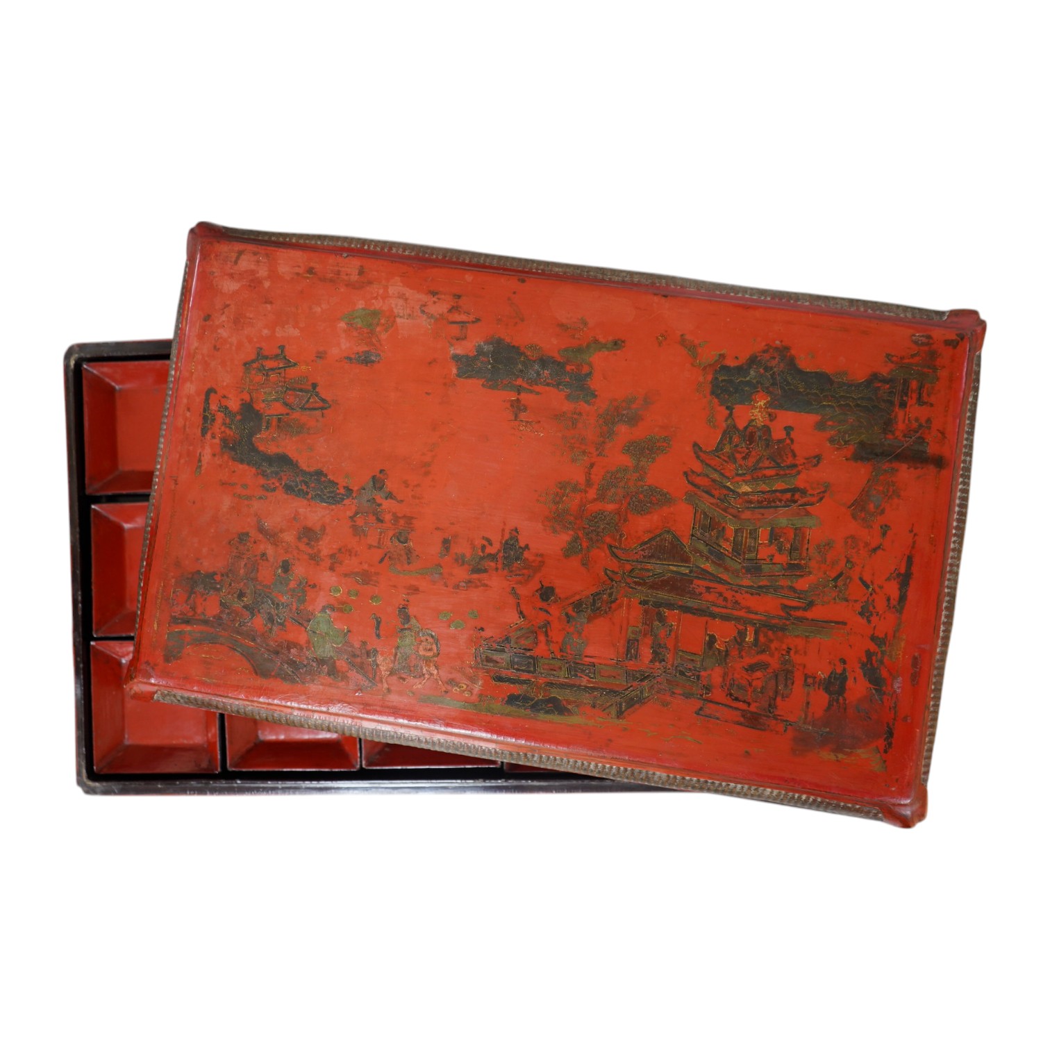 A Chinese rectangular red lacquer supper set containing fifteen small trays, Ming Dynasty, 50cm wide. Condition - fair, heavy wear